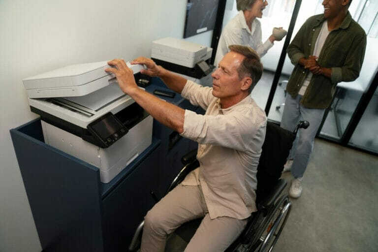 man-wheelchair-having-office-job (1) (1)