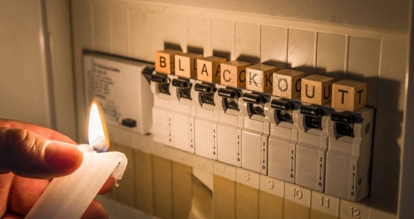 a fuse box with the letters from "blackout," signifying a power outage